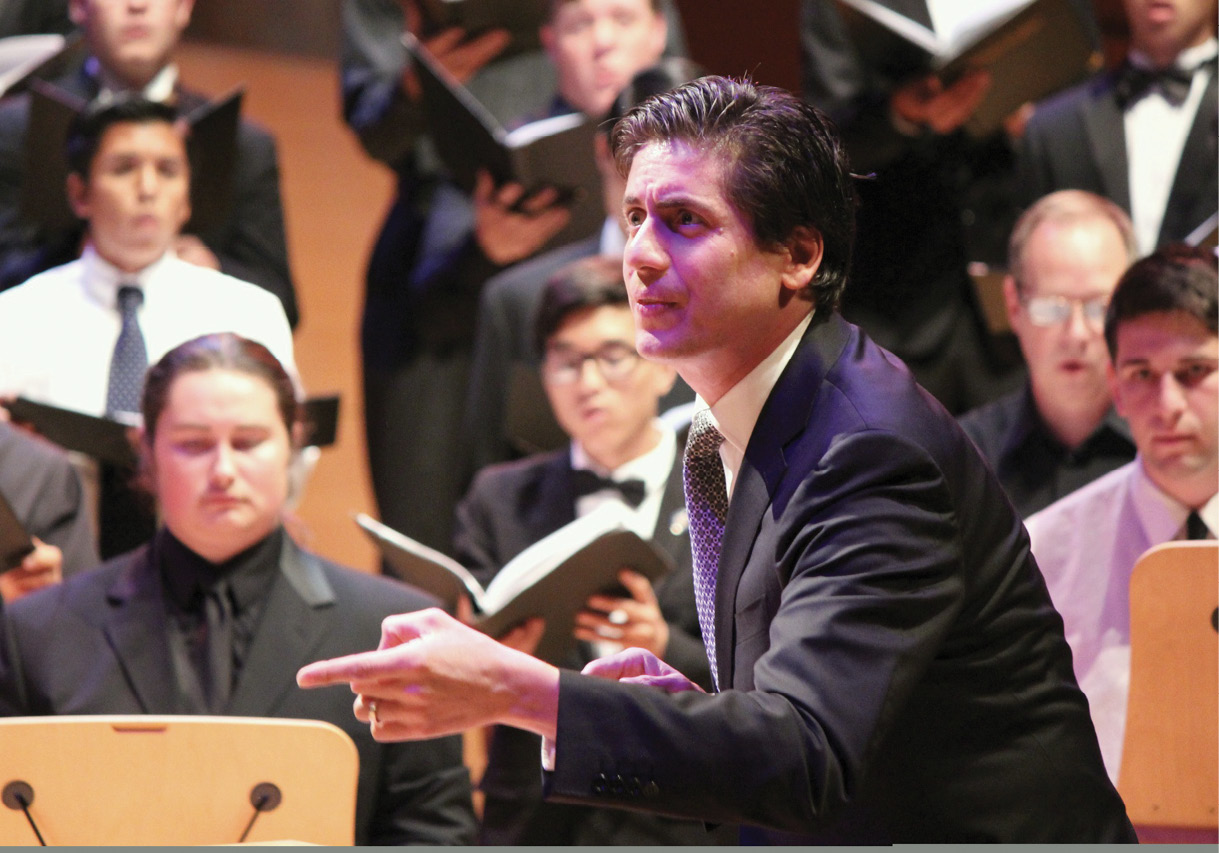 Man directing choir.